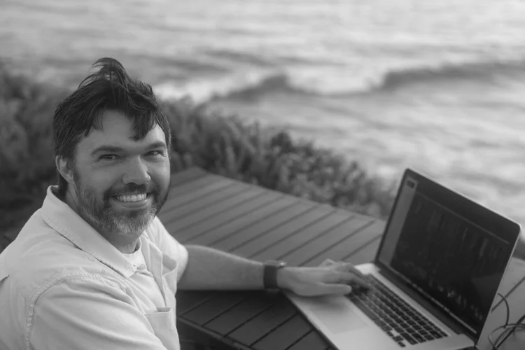 Gabe Thorburn editing outdoors
